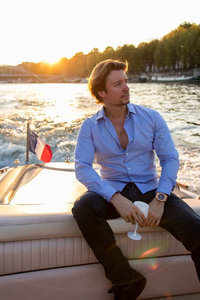 Portrait of Warren von Rich, enjoying a sunset boat cruise in France.