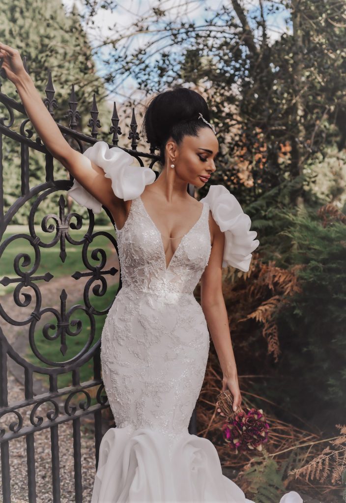 Madonna from Dando London Legends Bridal Collection - Mermaid dress with beaded detail, plunging V-neck & ruched skirt & short puff sleeves