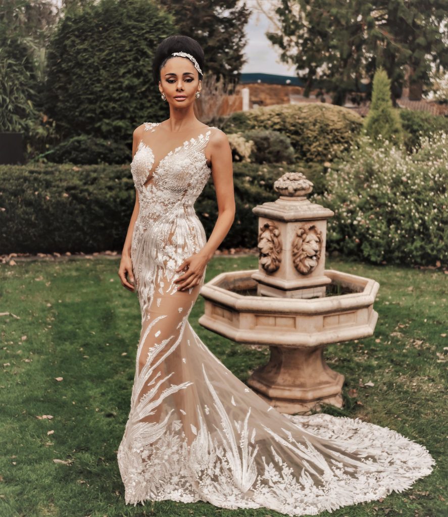 Janet Jackson from Dando London Legends Bridal Collection - Sheer column dress with beaded & sequined lace motifs & a detachable horsehair edged embellished tulle train.