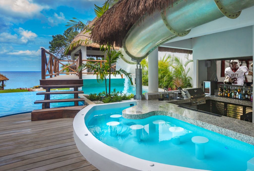 Swim-up Hot-Tub Bar with Flat Screen TV at Private Paradise Cozumel - Mexico's most exclusive, lavish, and entertaining private villa destination.