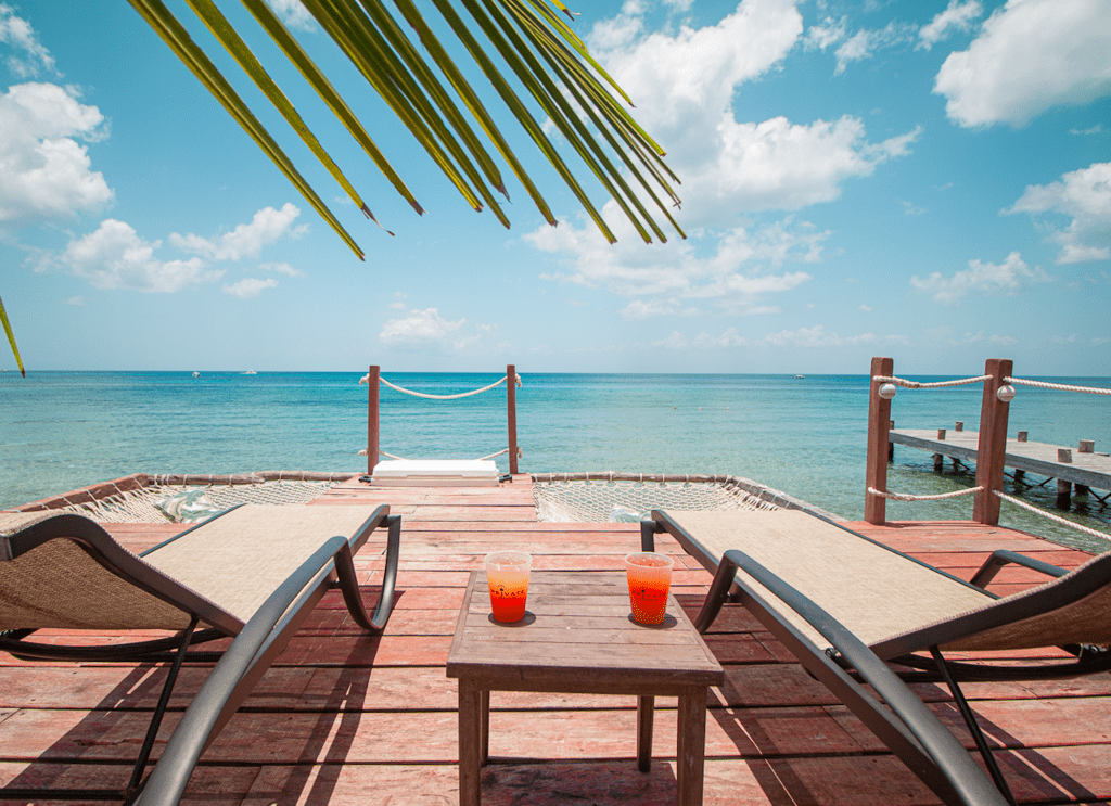 Patio with Lounge Chairs and Overwater Hammocks on the Caribbean Ocean at Private Paradise Cozumel 