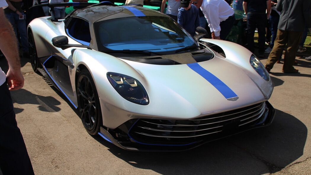 2025 Aston Martin Valhalla with blue stripe surrounded by people