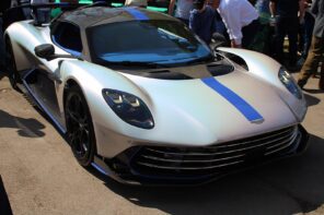 2025 Aston Martin Valhalla with blue stripe surrounded by people