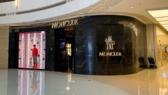 Moncler store at MixC Zhengzhou with mannequin in red jacket