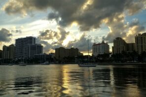 West Palm Beach city skyline at sunset with boats on the water