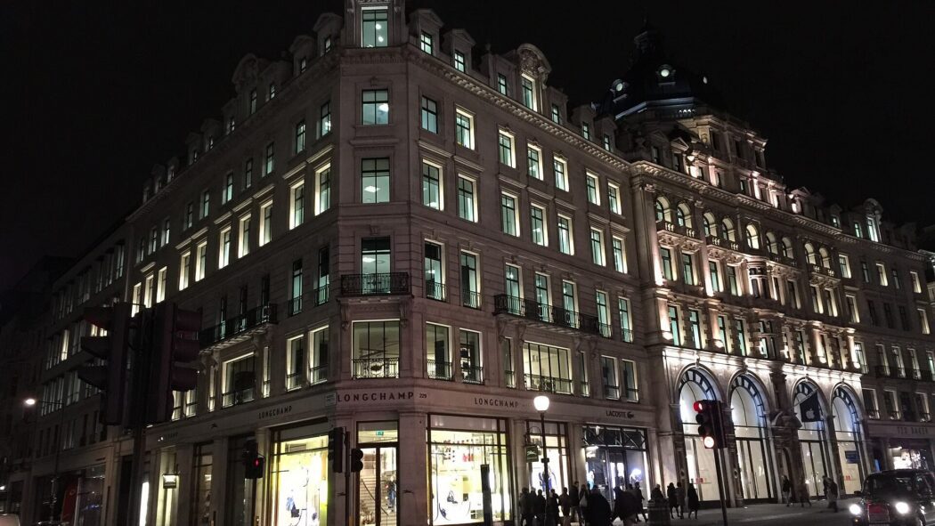 Historic buildings and shops in Mayfair, London at night