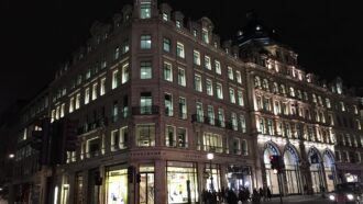 Historic buildings and shops in Mayfair, London at night