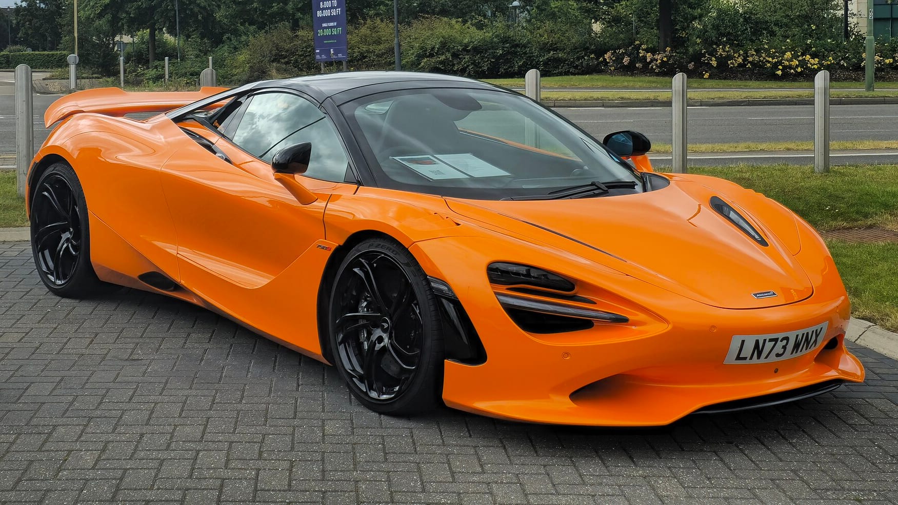 2024 McLaren 750S in orange parked on a street